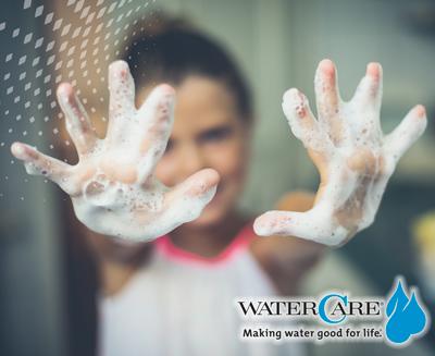 close up of child's hands full of soap suds